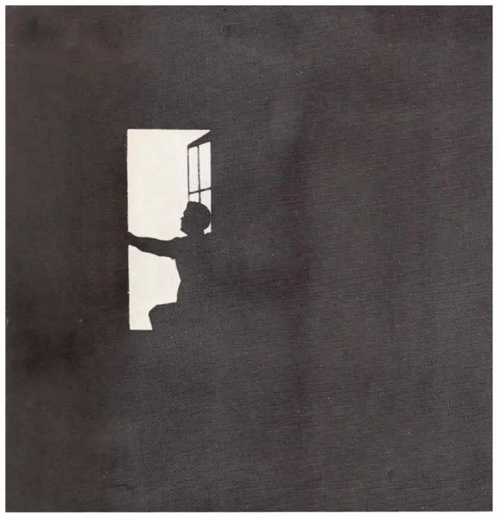 A person is silhouetted against a window