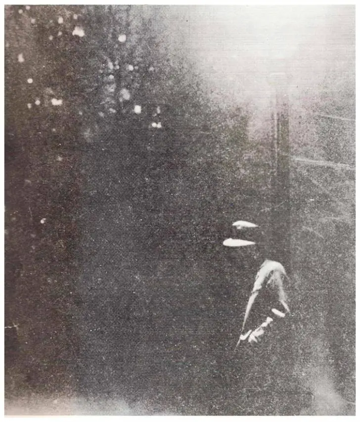 The card shows a man leaning against a lamppost at night in a hazy atmosphere.