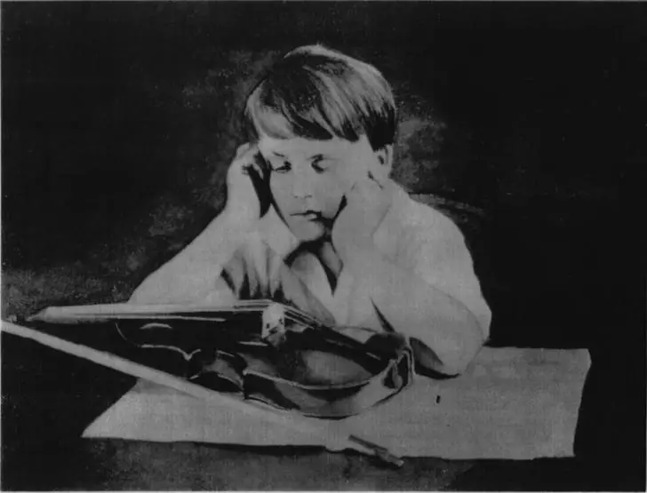 boy looking at violin